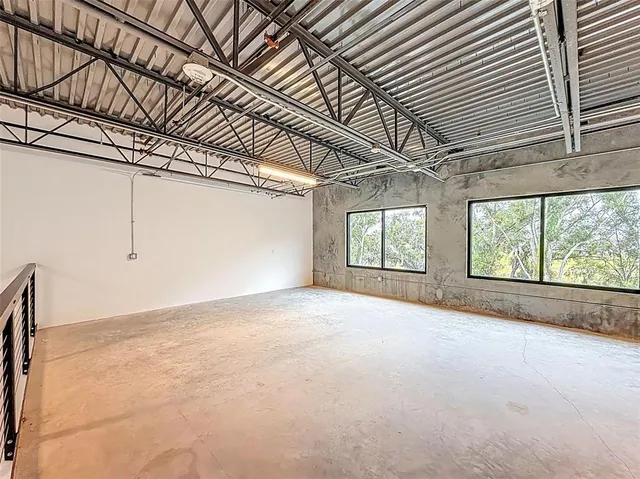 a view of a room with wooden walls