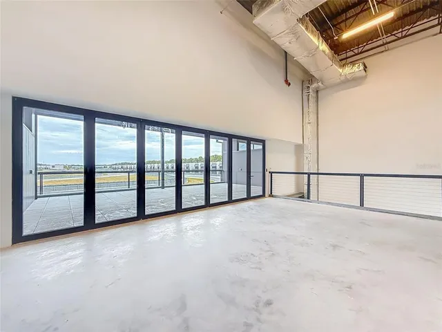 a view of an empty room with a large window