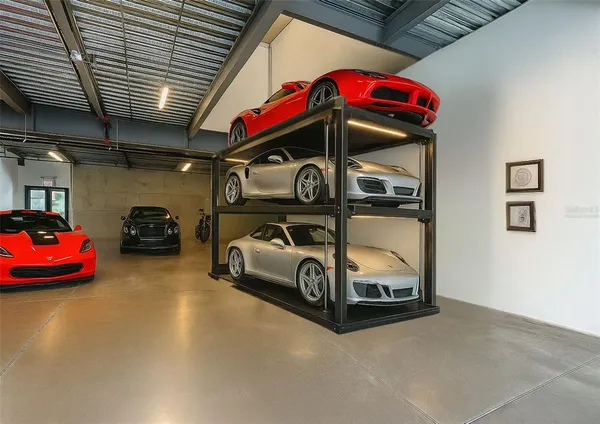 a living room with furniture a rug and white walls