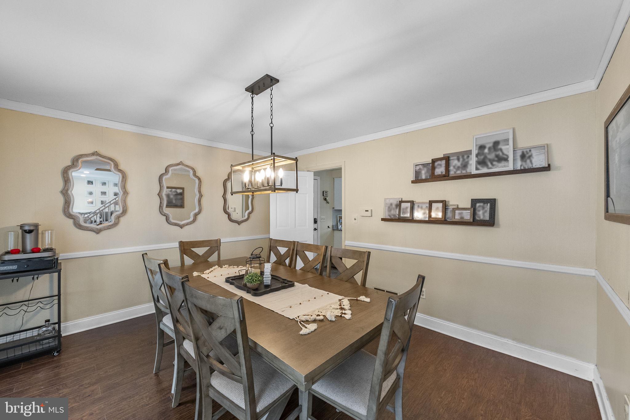 4 Birch Run Court Ewing, NJ 08628 - Photo 23 of 57 a view of a dining room with furniture a chandelier and wooden floor