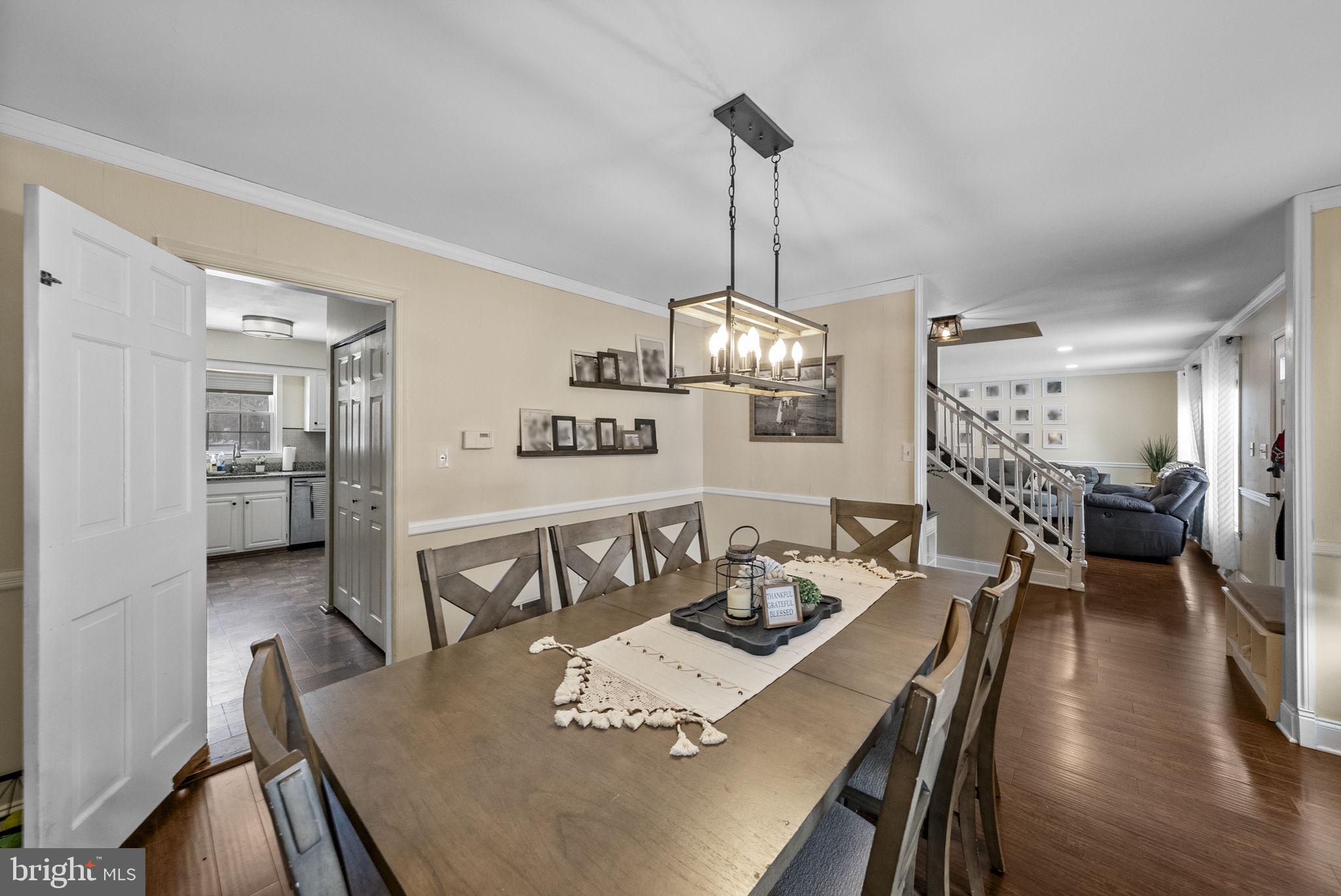 4 Birch Run Court Ewing, NJ 08628 - Photo 24 of 57 a view of a dining room and livingroom with furniture wooden floor a chandelier