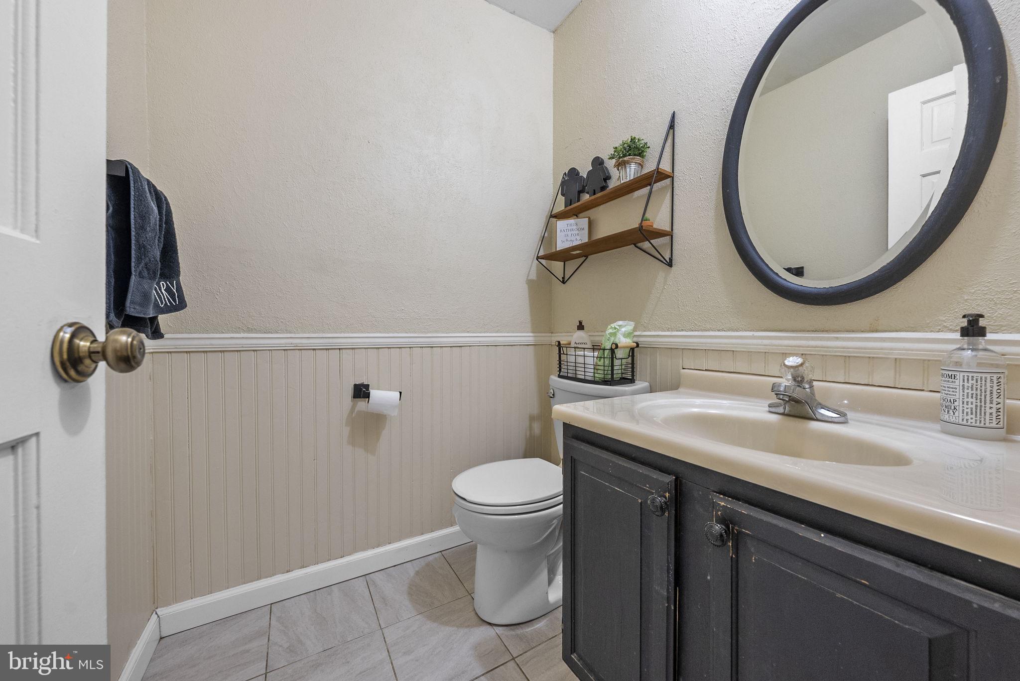 4 Birch Run Court Ewing, NJ 08628 - Photo 25 of 57 a bathroom with a toilet a sink and a mirror