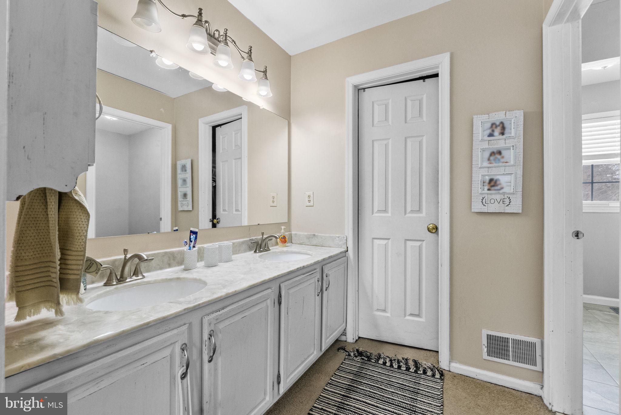 4 Birch Run Court Ewing, NJ 08628 - Photo 30 of 57 a spacious bathroom with a double vanity sink a mirror and a shower