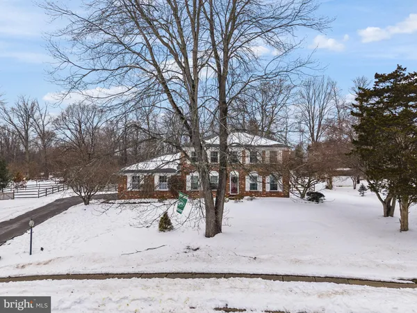 a view of a house with a snow in the yard