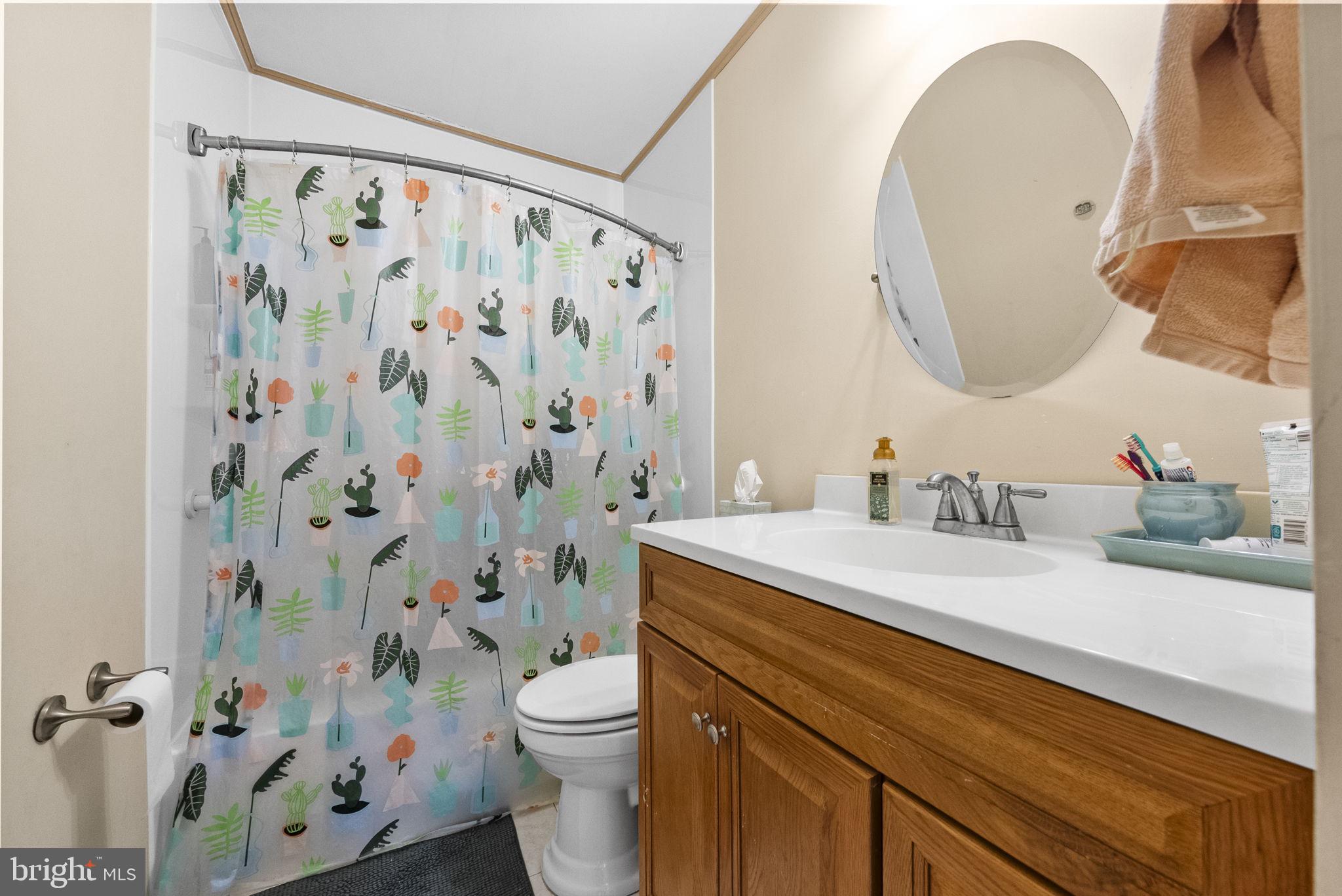 4 Birch Run Court Ewing, NJ 08628 - Photo 37 of 57 a bathroom with a granite countertop sink mirror vanity and toilet