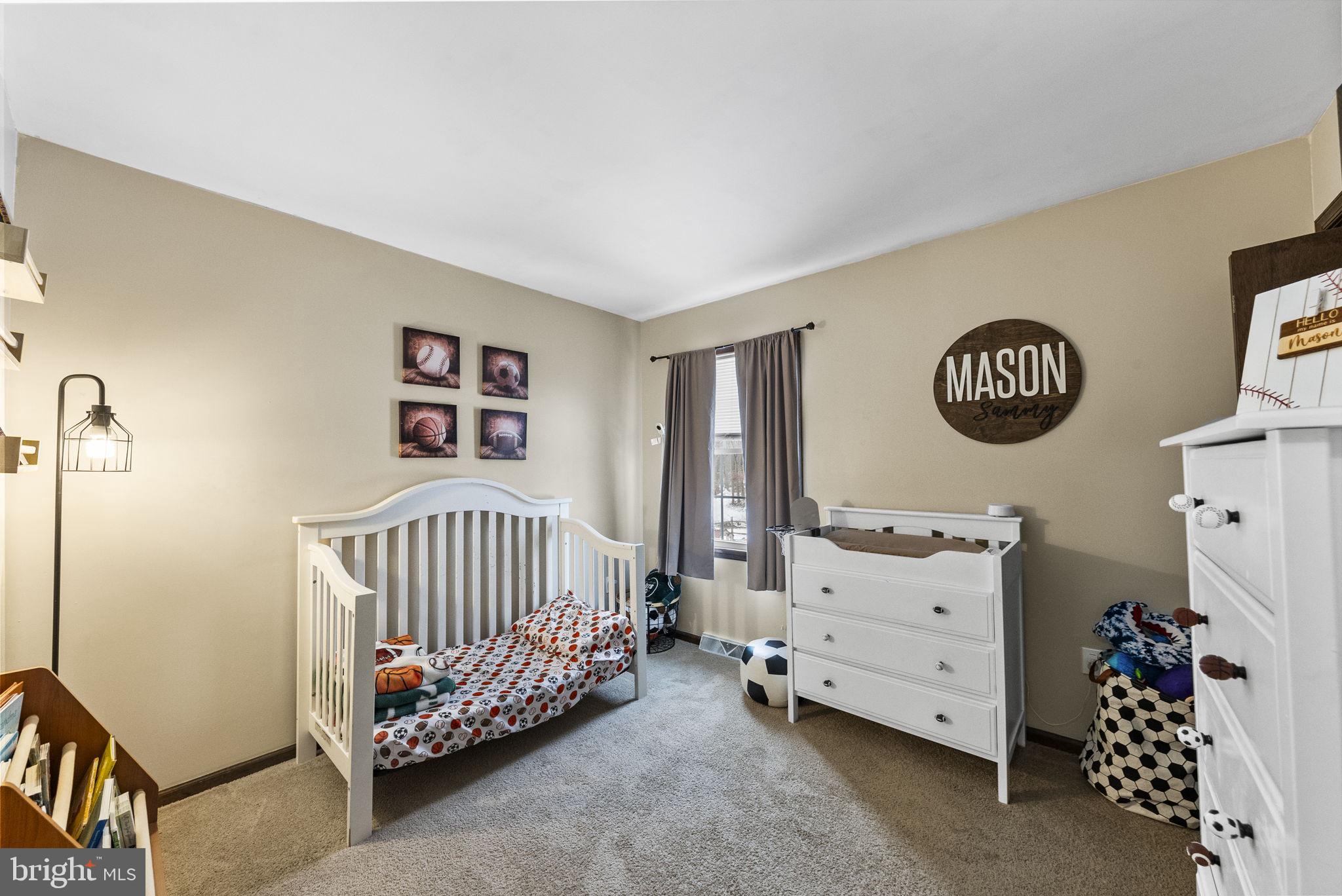 4 Birch Run Court Ewing, NJ 08628 - Photo 40 of 57 a bedroom with a bed and a baby crib
