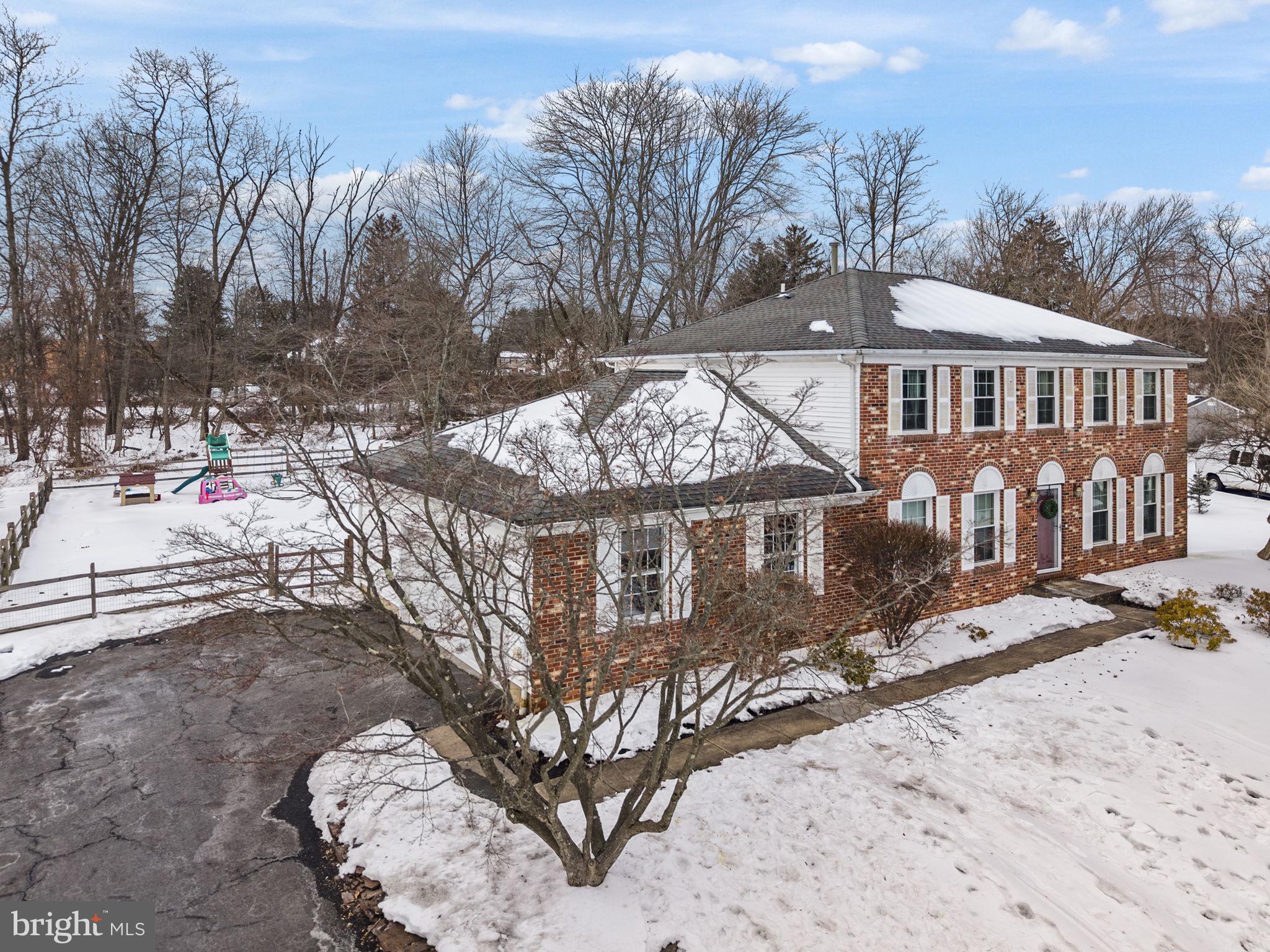 4 Birch Run Court Ewing, NJ 08628 - Photo 4 of 57 a view of a house with a snow in the yard