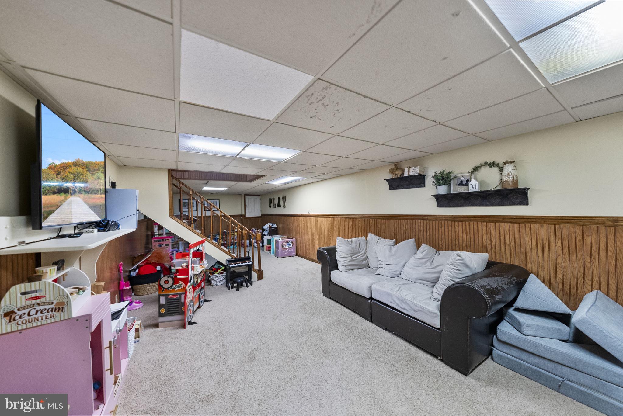 4 Birch Run Court Ewing, NJ 08628 - Photo 44 of 57 a living room with furniture and a flat screen tv