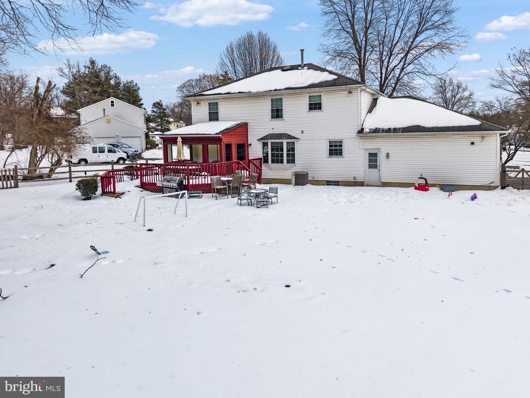 4 Birch Run Court Ewing, NJ 08628 - Photo 5 of 57 a view of a white house in the snow yard