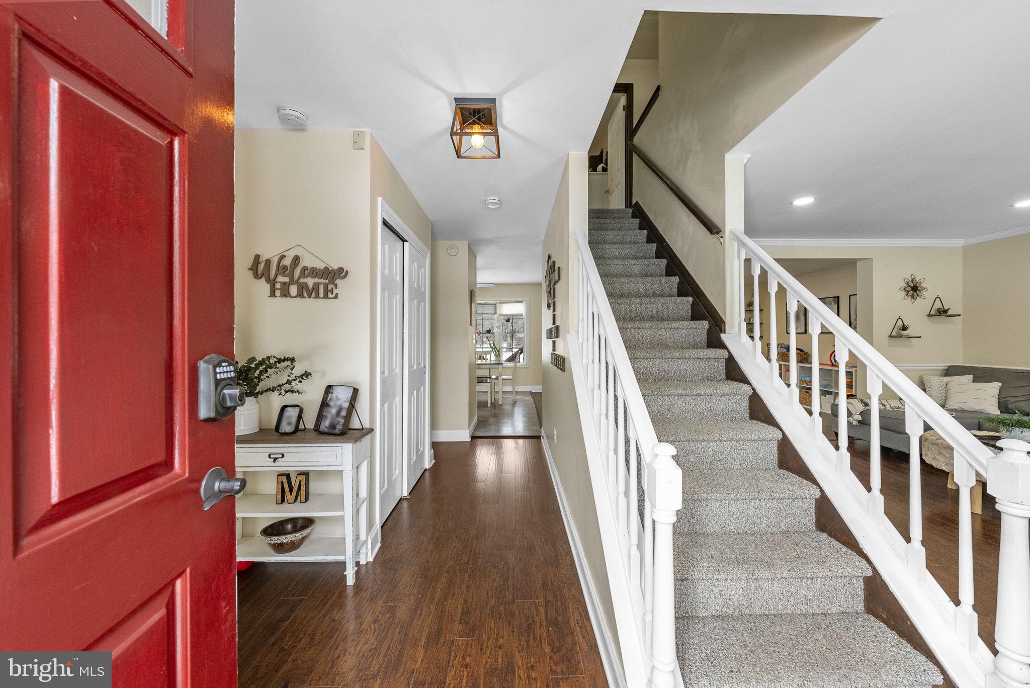 4 Birch Run Court Ewing, NJ 08628 - Photo 8 of 57 a view of a hallway with wooden floor and staircase