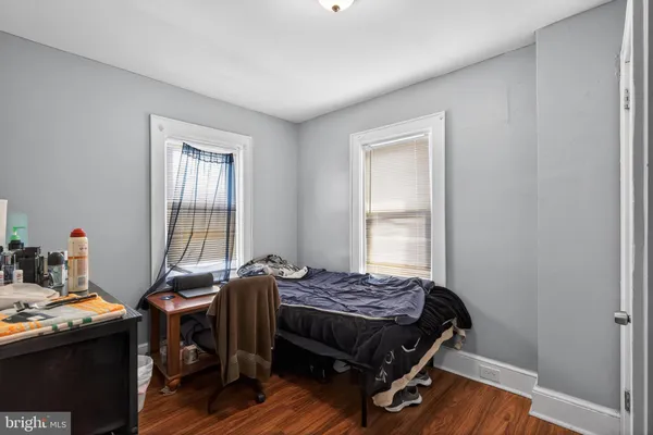 a bed room with a bed and a window