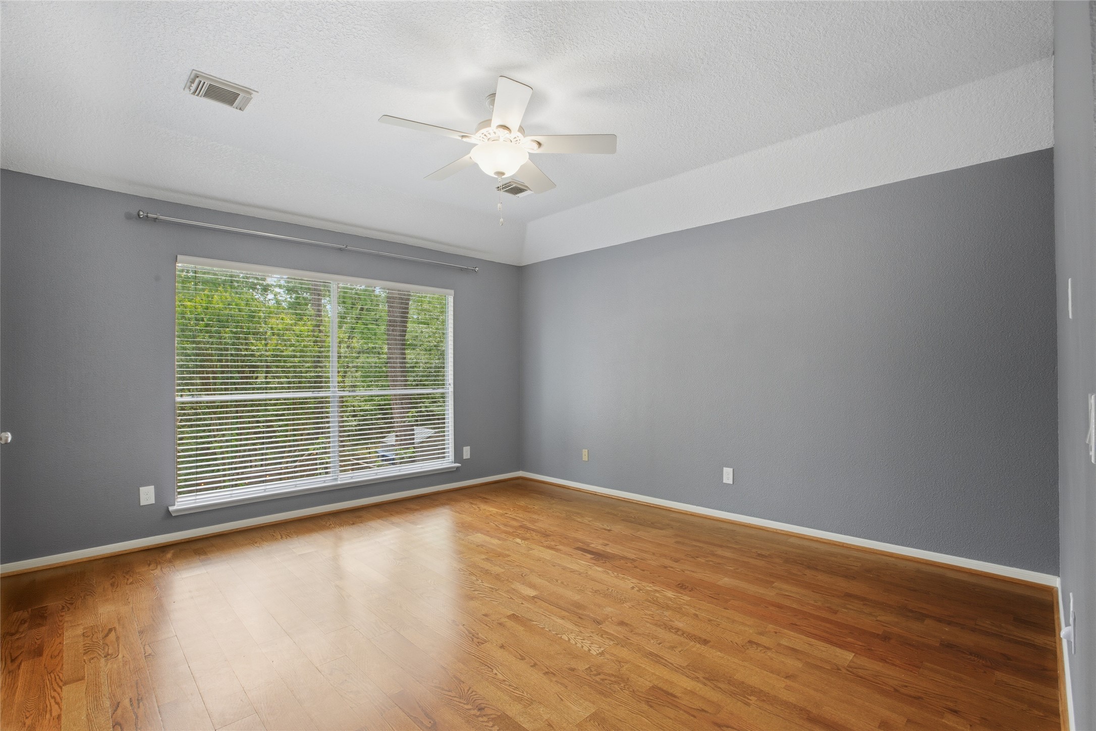 20907 Nettlebrook Lane Katy, TX 77450 - Photo 23 of 46 Large windows bring in natural light, giving the room a soft, relaxed feel throughout the day.