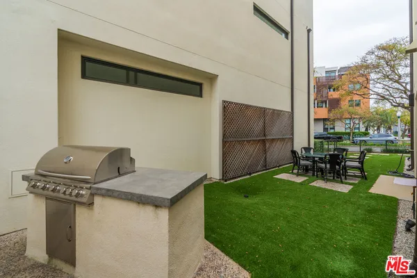 a view of backyard with trampoline
