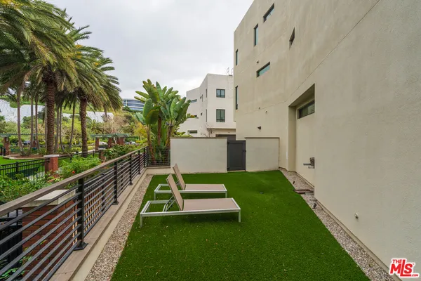 a view of balcony with a yard and furniture