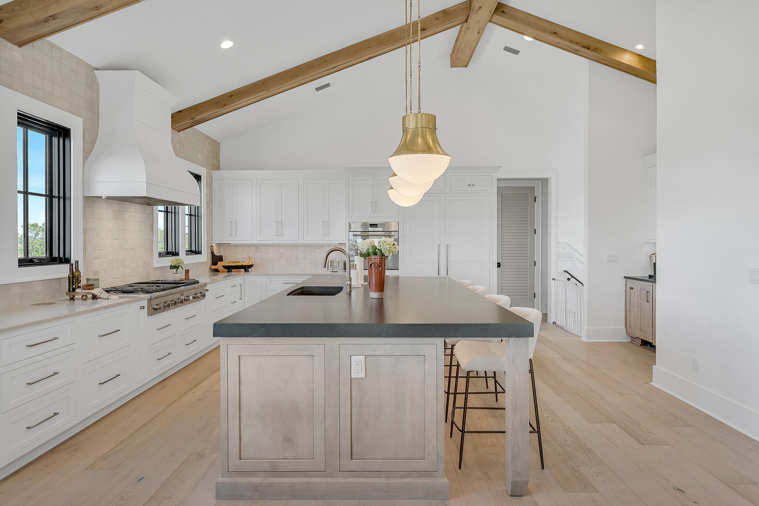 7843 East County Highway 30A Inlet Beach, FL 32461 - Photo 15 of 71 a kitchen with a sink cabinets and wooden floor