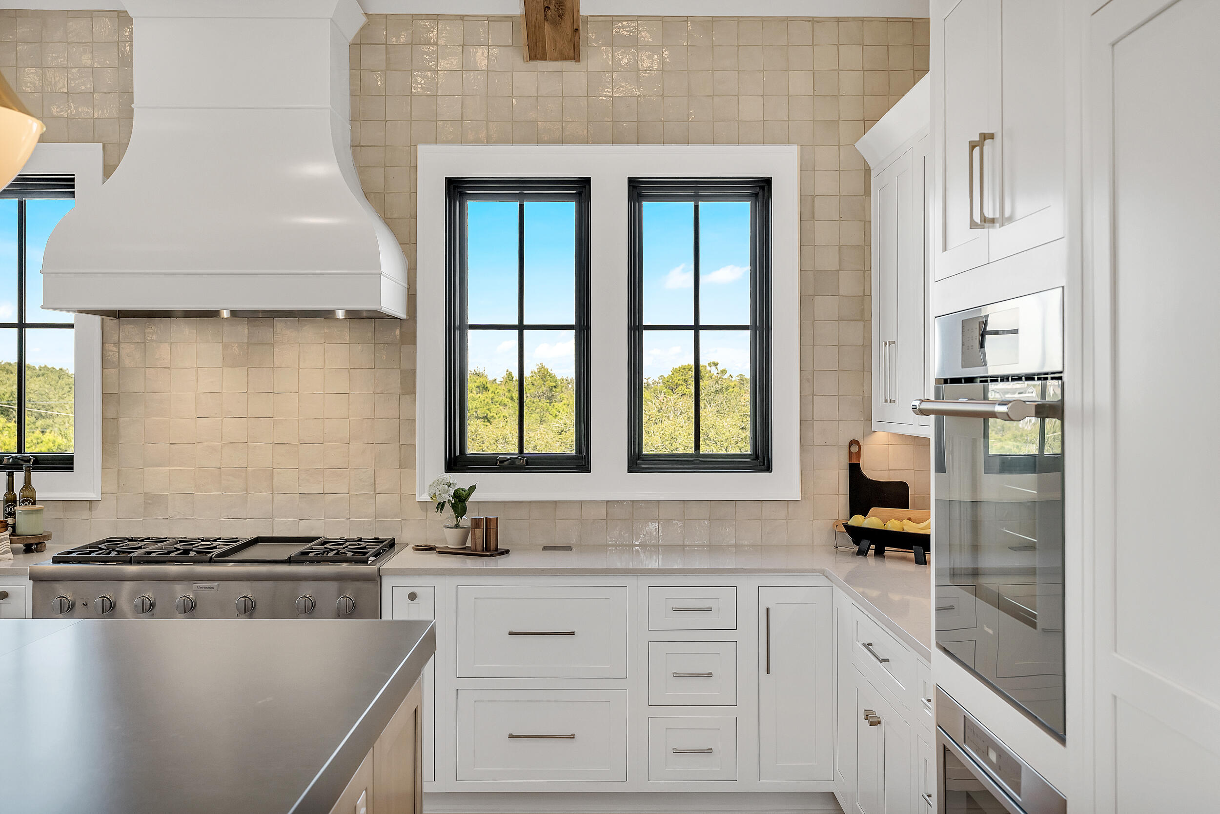 7843 East County Highway 30A Inlet Beach, FL 32461 - Photo 16 of 71 a kitchen with granite countertop white cabinets and white appliances