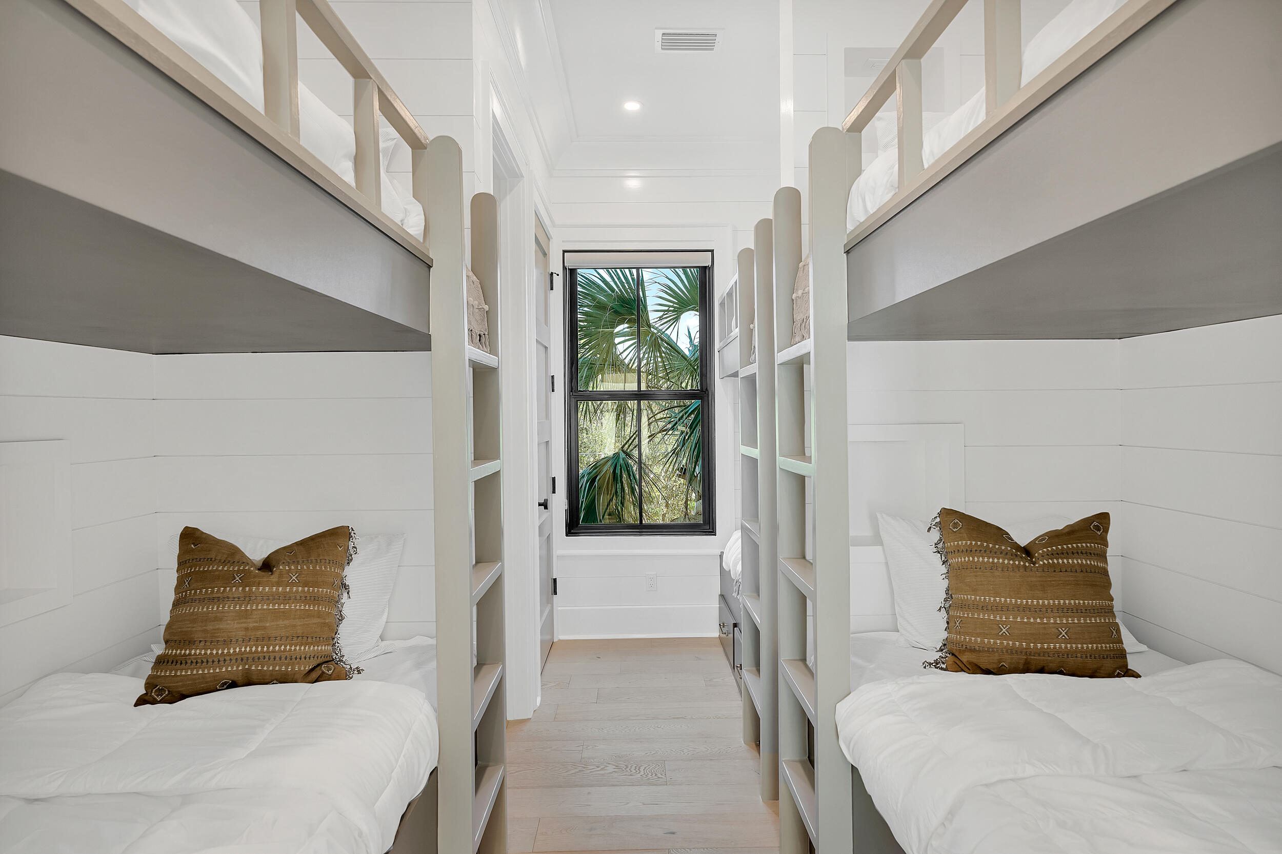 7843 East County Highway 30A Inlet Beach, FL 32461 - Photo 39 of 71 a bedroom with a bed and a large window