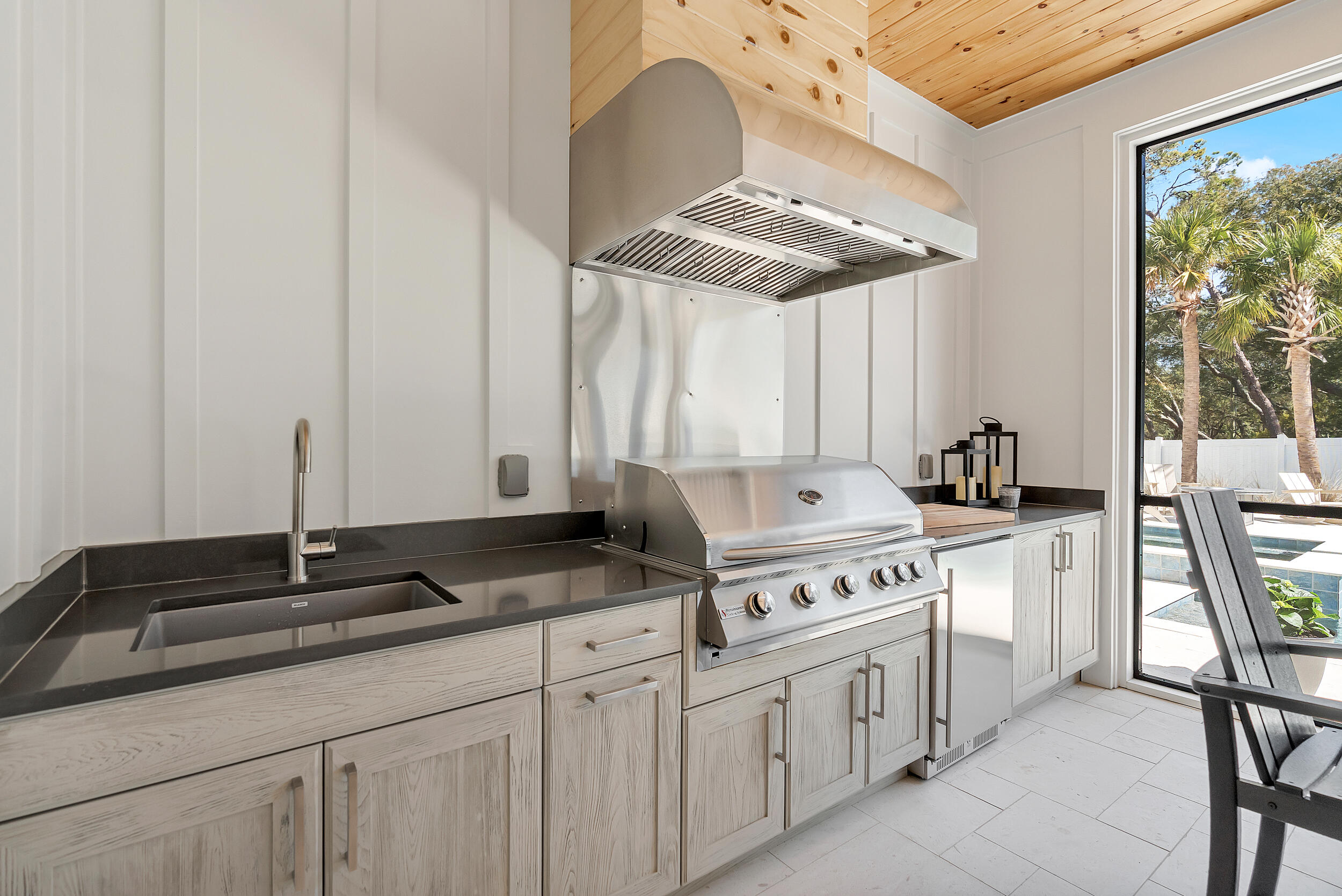7843 East County Highway 30A Inlet Beach, FL 32461 - Photo 53 of 71 a kitchen with stainless steel appliances granite countertop a sink stove and cabinets