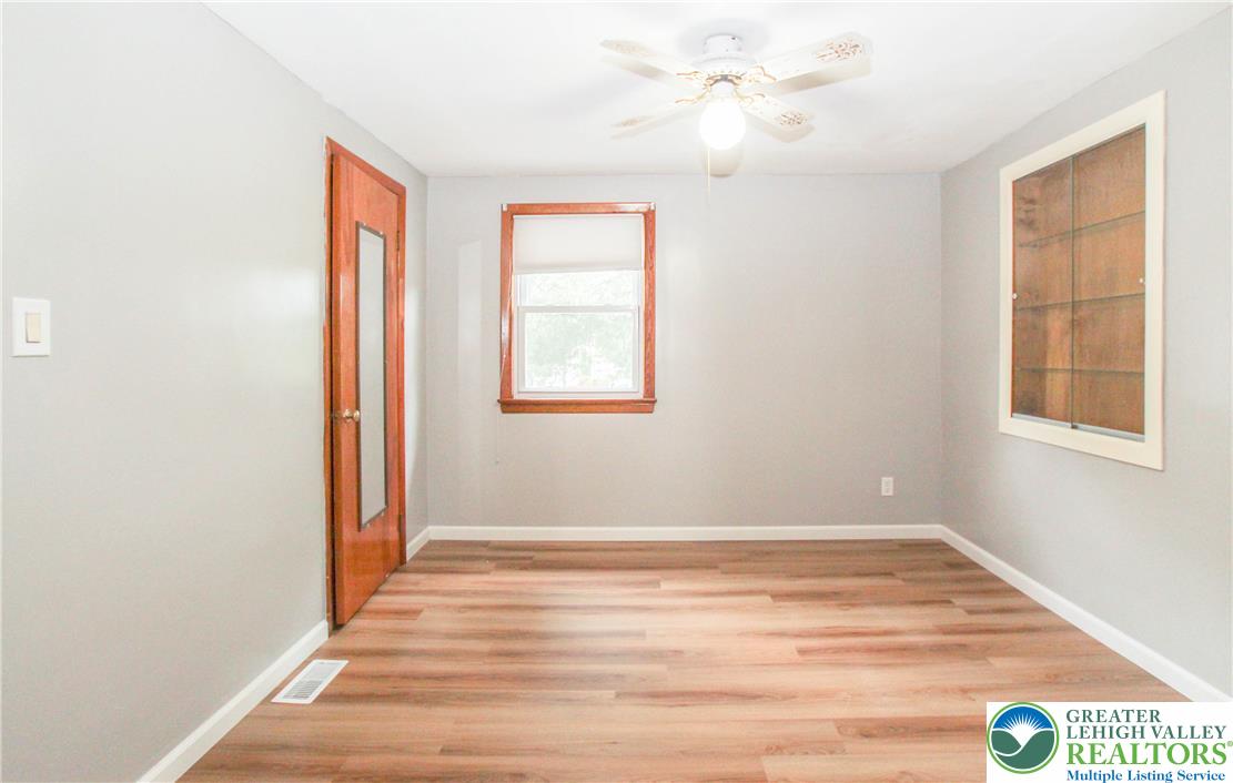 492 Filetown Road Nazareth, PA 18064 - Photo 13 of 30 Laminate flooring and a functional ceiling fan define this flexible space, ready for your personal touch.