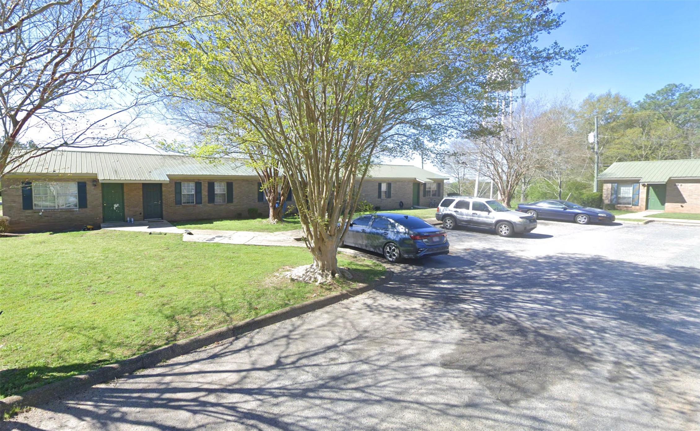 598 Hartley Street Other, AL 36456 - Photo 3 of 13 a view of a yard with cars