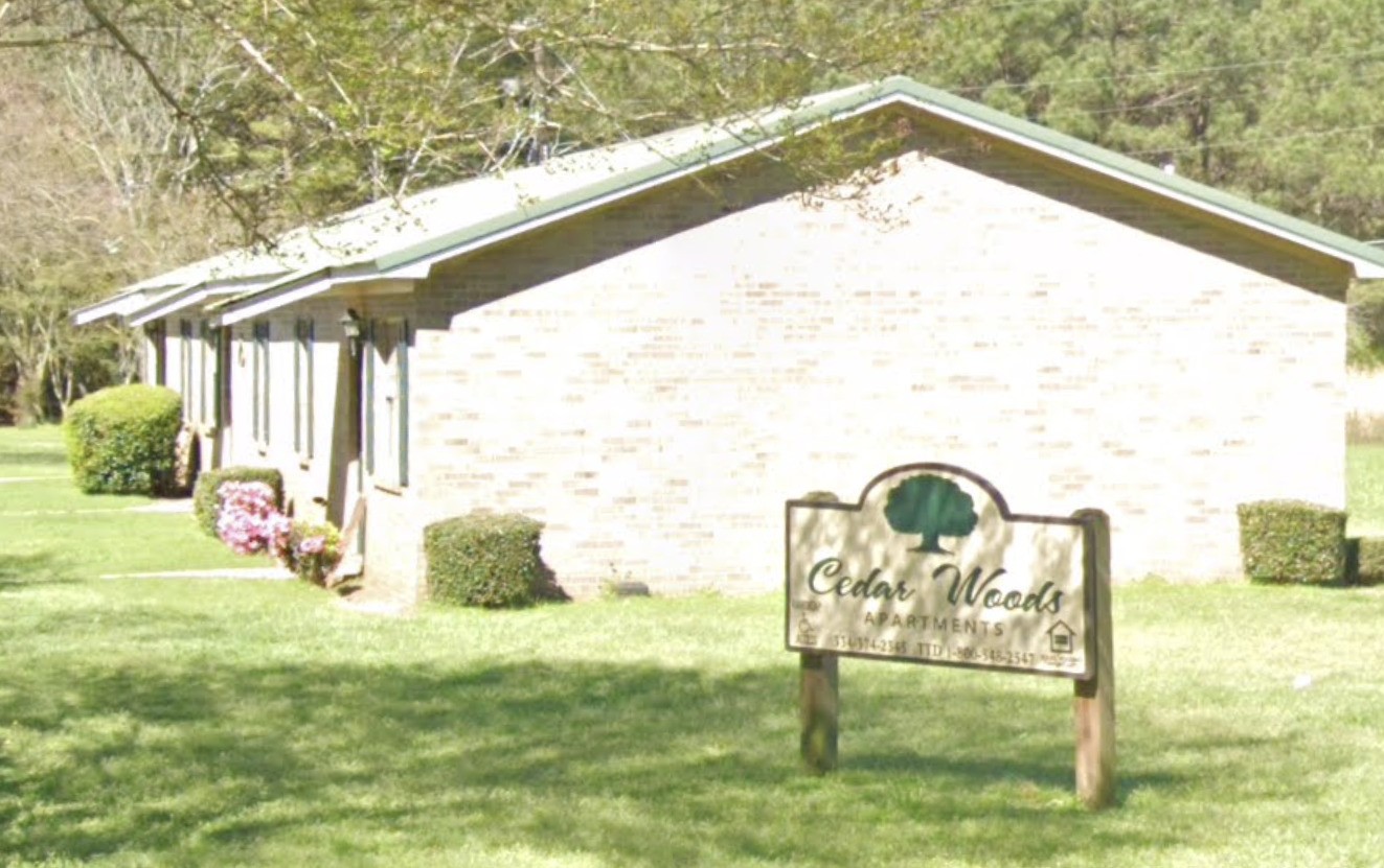 598 Hartley Street Other, AL 36456 - Photo 4 of 13 a bench sitting in front of a building