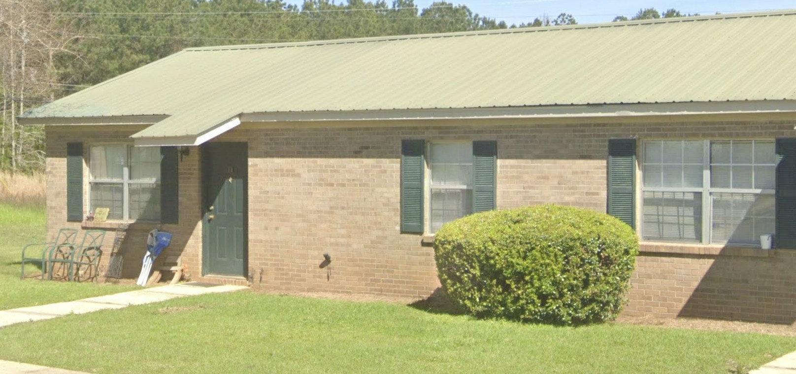 598 Hartley Street Other, AL 36456 - Photo 7 of 13 a front view of a house with a yard