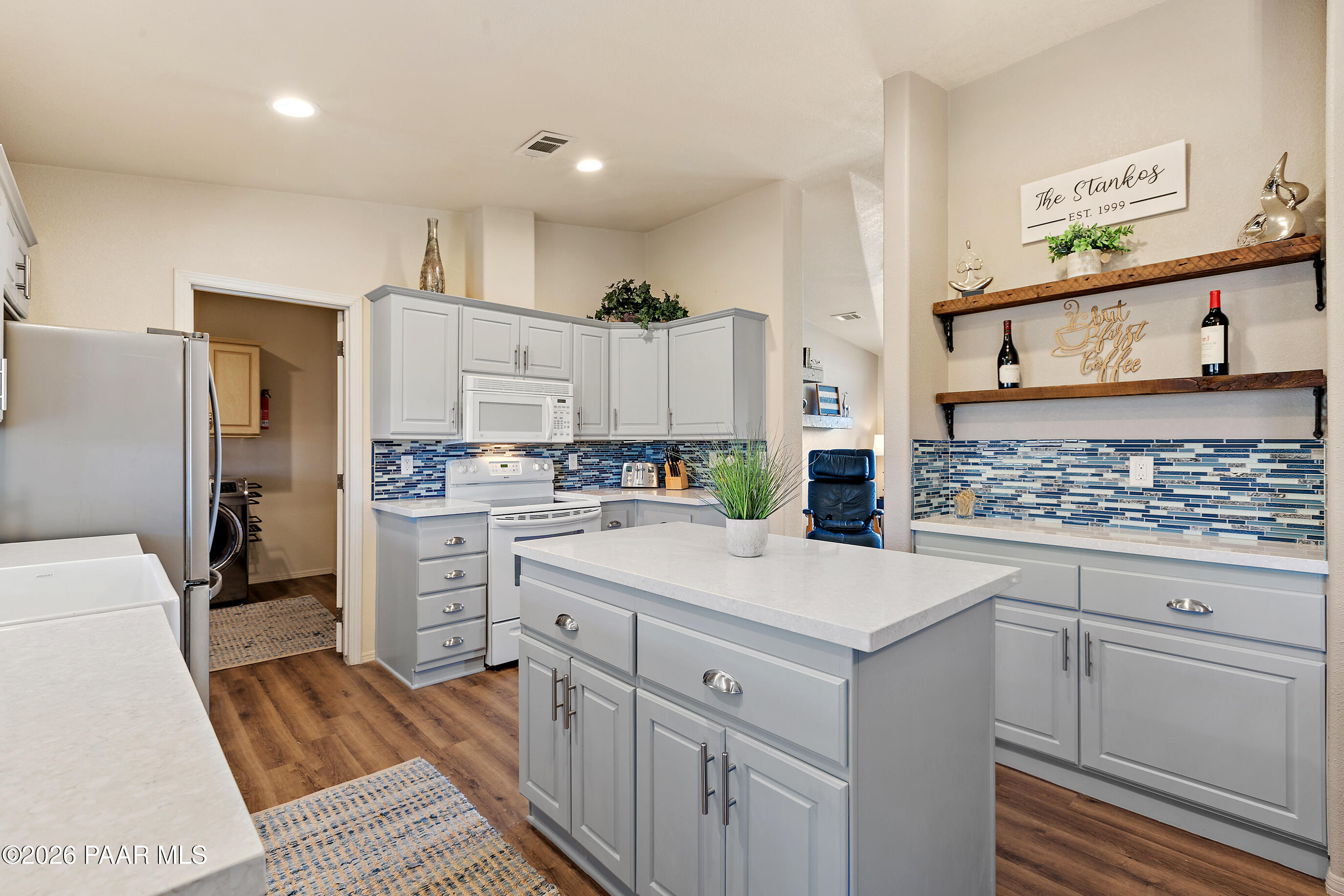 11250 East State Rte 69 Dewey, AZ 86327 - Photo 12 of 38 a kitchen with white cabinets and appliances