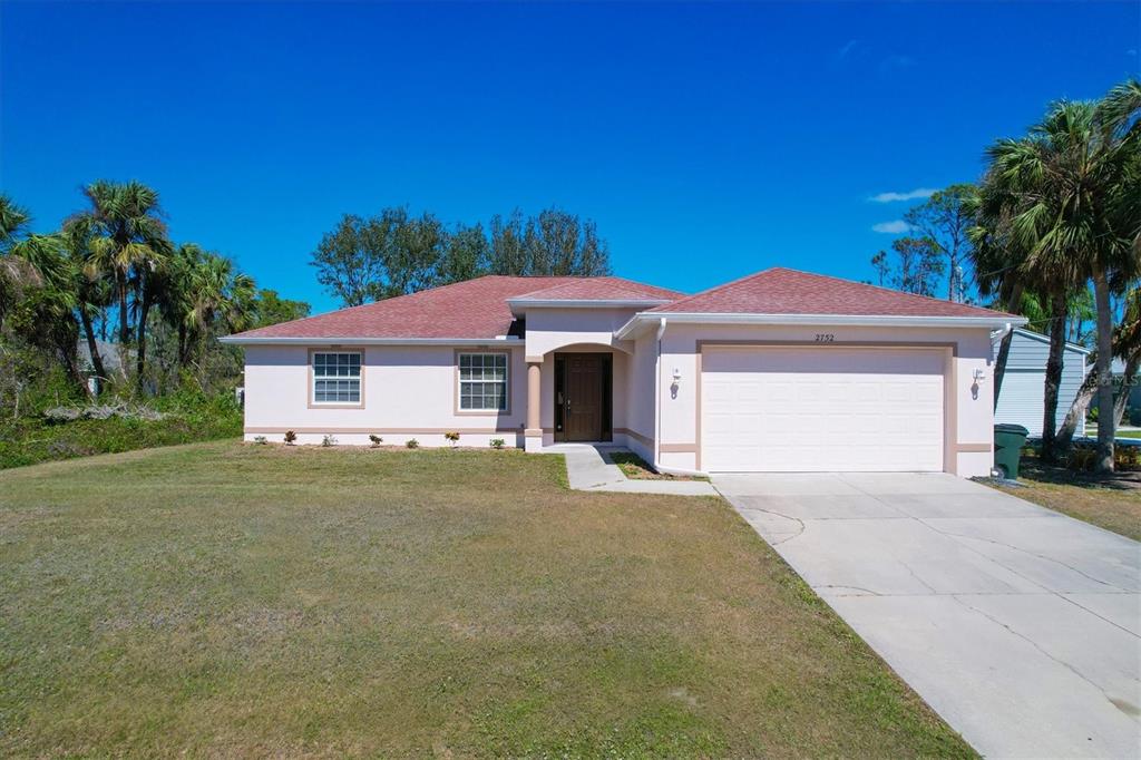 2752 Firebrand Road North Port, FL 34288 - Photo 1 of 1 Pillared covered Front Entry with eight foot door and side lights. Plus a Freshly painted exterior.