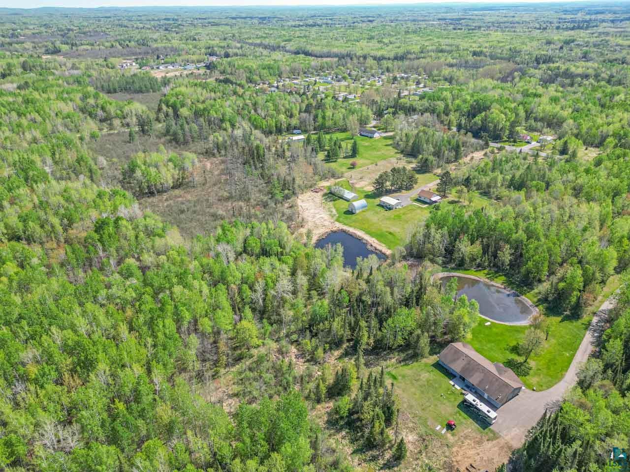 2581 O'Rourke Road Hibbing, MN 55746 - Photo 61 of 61 Expansive aerial view showcasing a large wooded property with two visible ponds