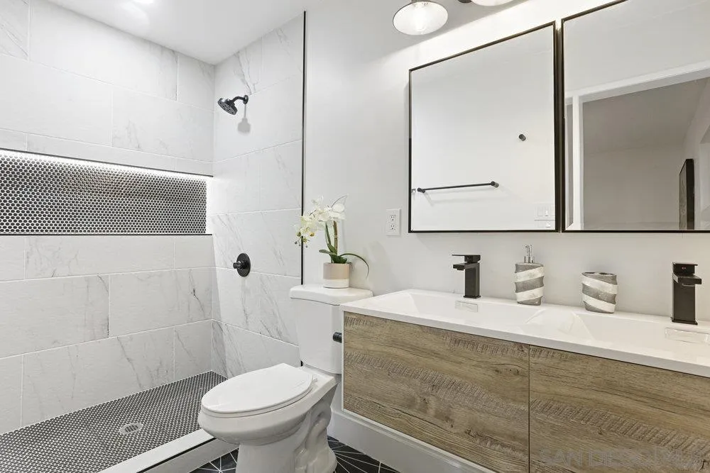 3255 Roberta Lane Oceanside, CA 92054 - Photo 11 of 24 a bathroom with a toilet sink and mirror