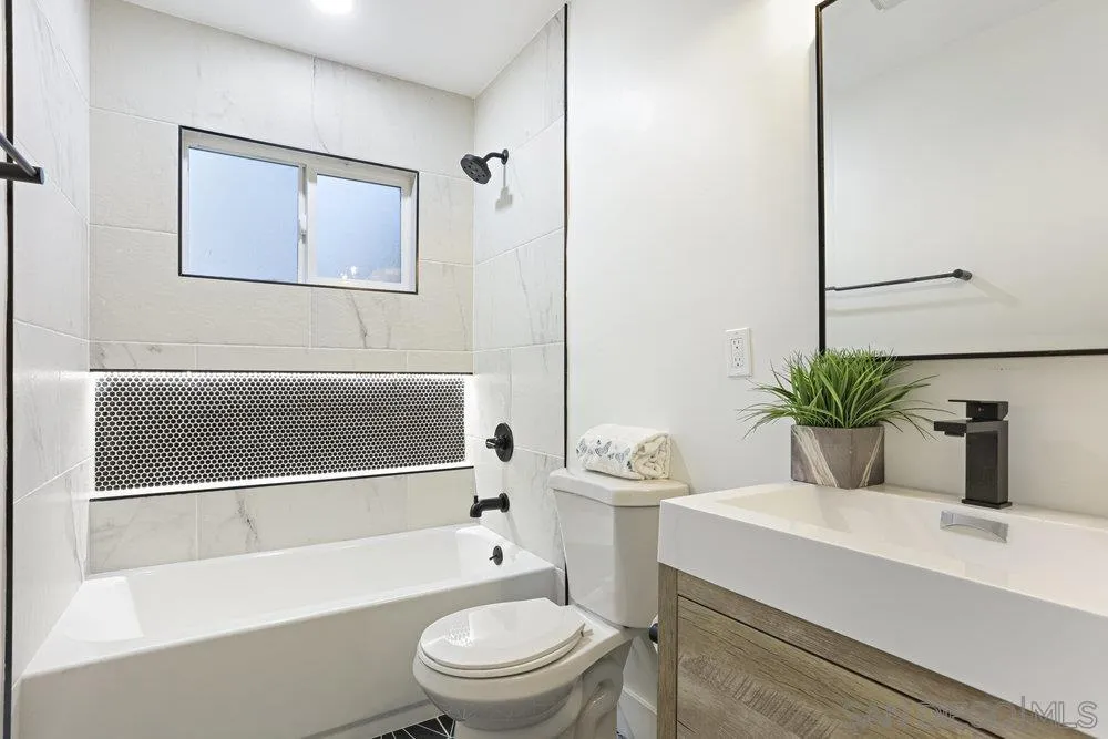 3255 Roberta Lane Oceanside, CA 92054 - Photo 16 of 24 a bathroom with a toilet a sink and bathtub