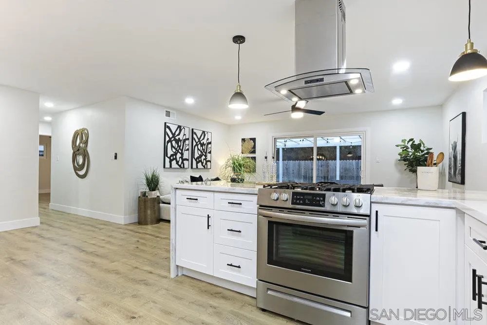 3255 Roberta Lane Oceanside, CA 92054 - Photo 2 of 24 a kitchen with a stove and cabinets