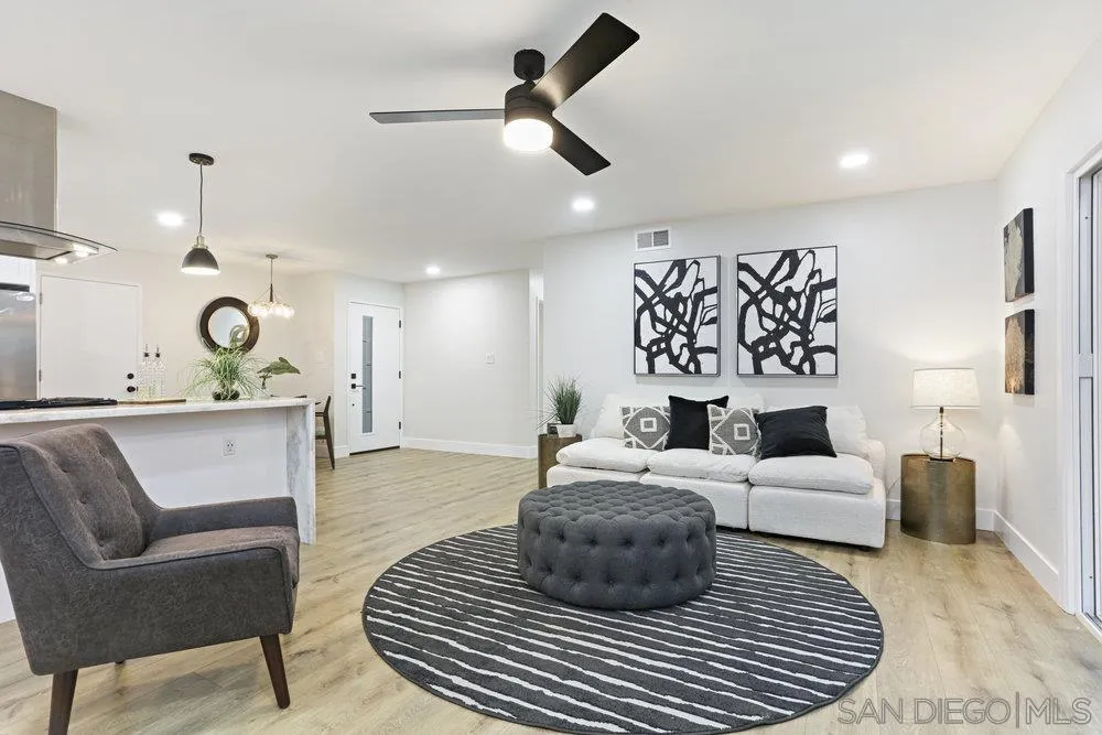 3255 Roberta Lane Oceanside, CA 92054 - Photo 5 of 24 a living room with furniture a ceiling fan and a rug