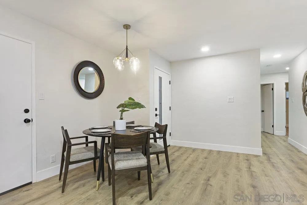 3255 Roberta Lane Oceanside, CA 92054 - Photo 8 of 24 a view of a dining room with furniture and wooden floor