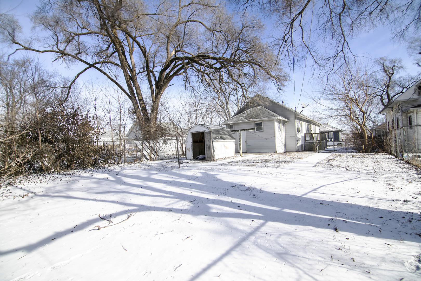 201 North Cottage Avenue Kankakee, IL 60901 - Photo 2 of 13 a view of a white house with a snow on the road