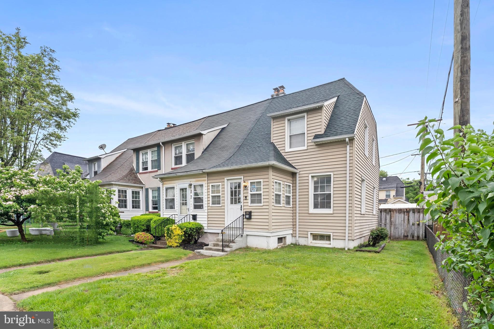 55 Kinship Road Baltimore, MD 21222 - Photo 1 of 42 a front view of a house with a garden