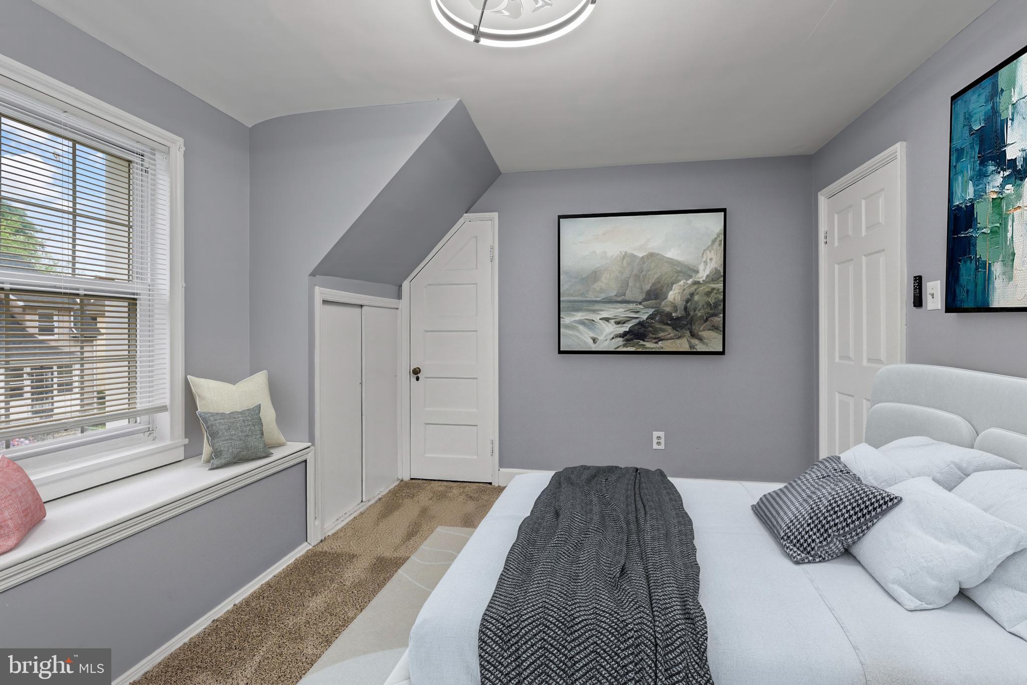 55 Kinship Road Baltimore, MD 21222 - Photo 27 of 42 a bedroom with a large bed and a window