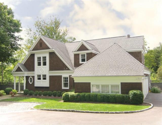 78 Prospect Ridge Ridgefield, CT 06877 - Photo 1 of 1 a front view of a house with a yard and garage