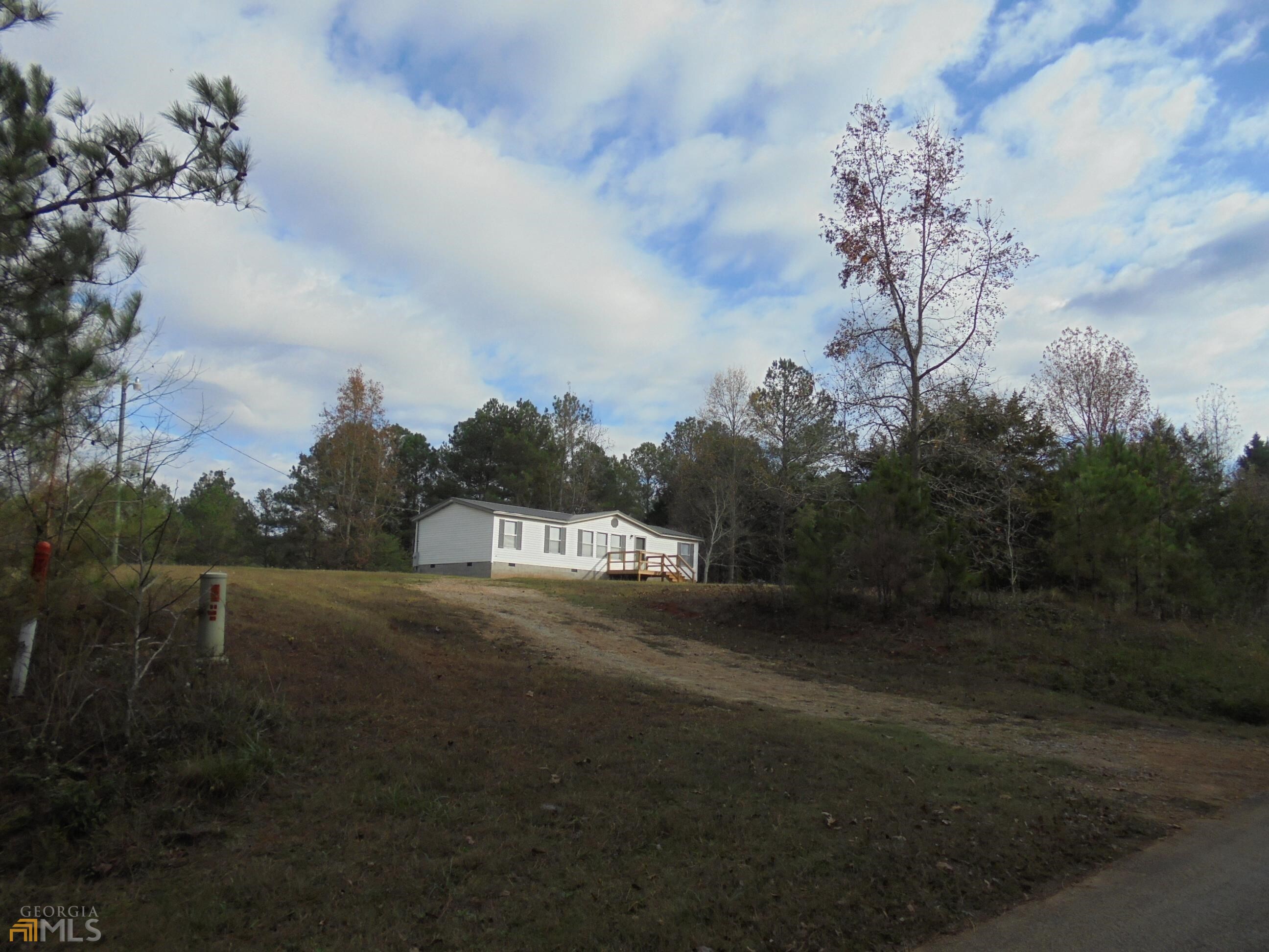 75 Hilley Road Royston, GA 30662 - Photo 1 of 1 a view of a street with a house in the background