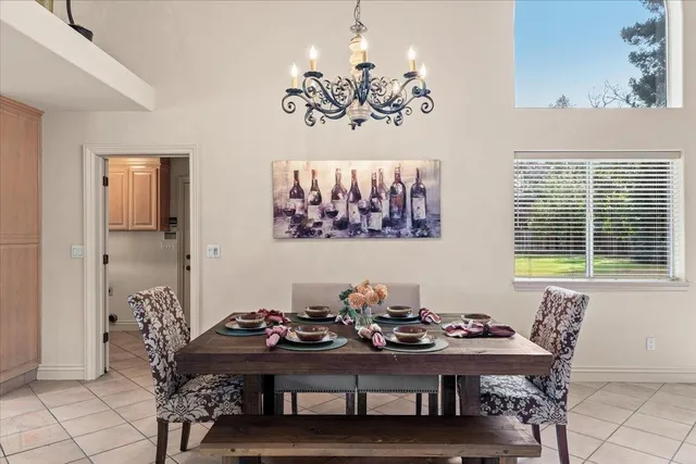 a kitchen with stainless steel appliances granite countertop a sink and a refrigerator