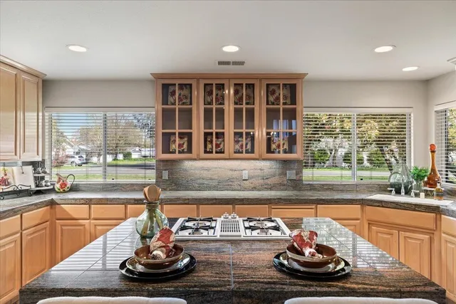 a view of a dining room with furniture a chandelier and wooden floor