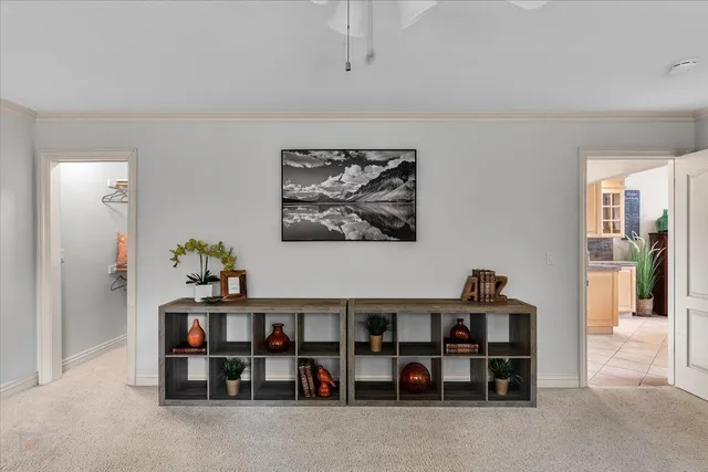 a living room with furniture and flowers