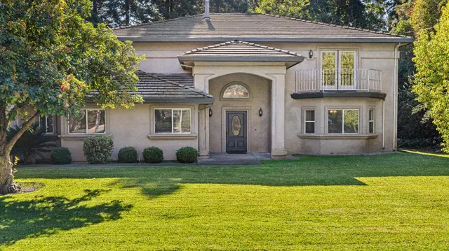 a front view of a house with washer and dryer