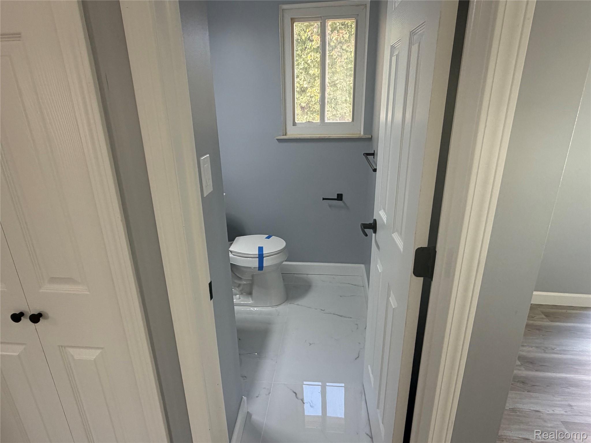 20698 Coachwood Road Riverview, MI 48193 - Photo 12 of 37 Bathroom with baseboards and marble finish floors