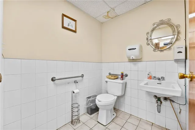 a bathroom with a toilet and a sink
