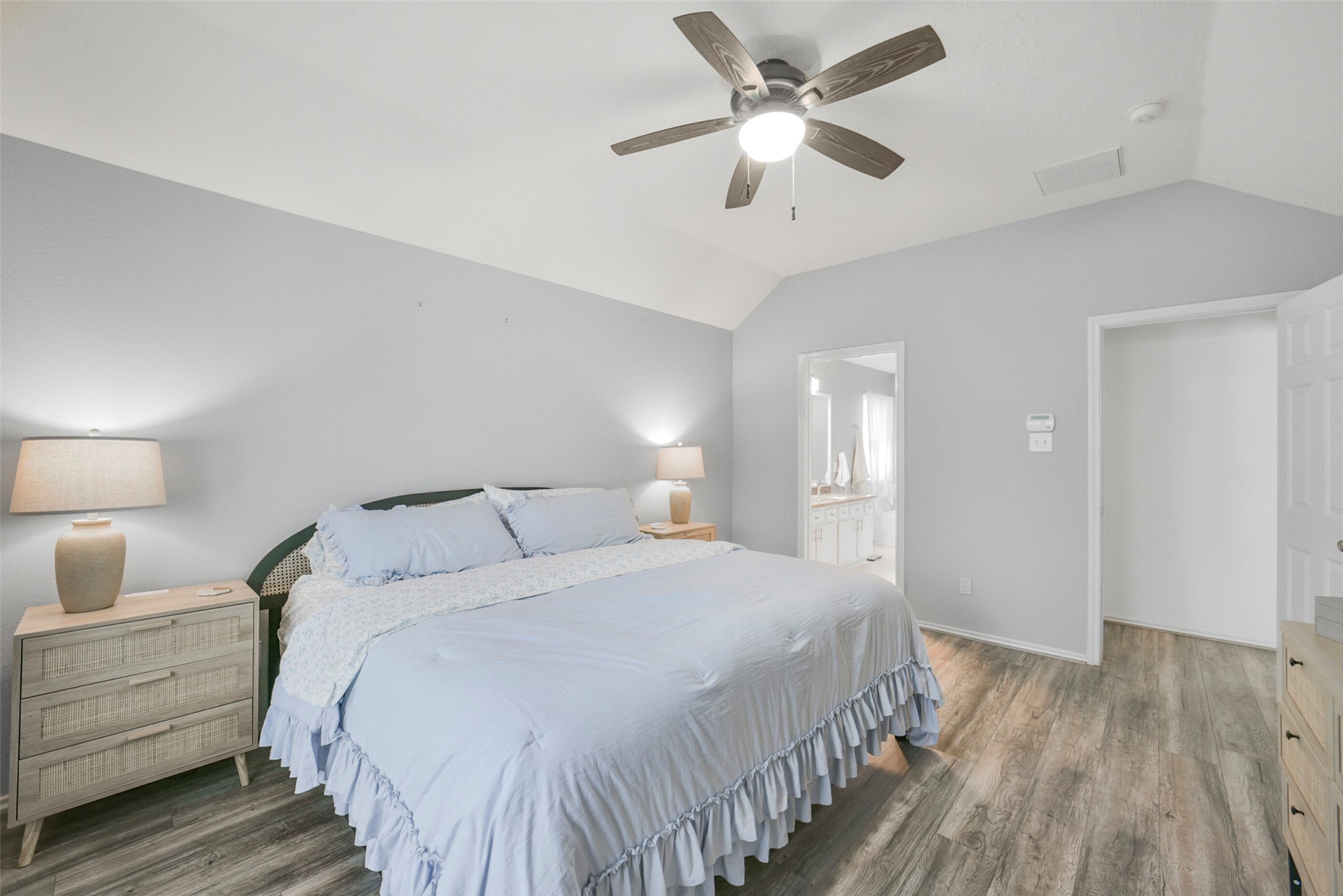 38 Tallow Hill Place Spring, TX 77382 - Photo 22 of 50 a bedroom with a large bed and a chandelier