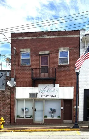 a view of brick building with large windows