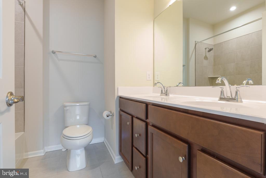 39 Sidney Lane Stratford, NJ 08084 - Photo 12 of 21 a bathroom with a sink a toilet and shower