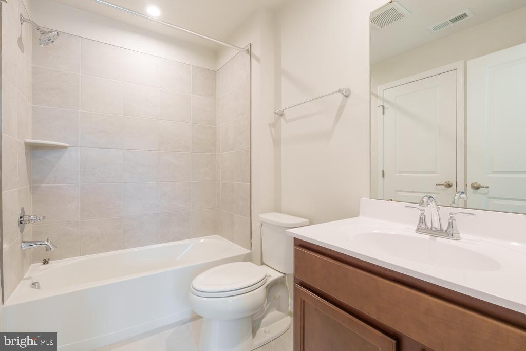 39 Sidney Lane Stratford, NJ 08084 - Photo 15 of 21 a bathroom with a sink a toilet and a bathtub