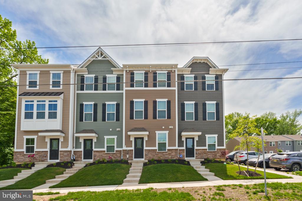 39 Sidney Lane Stratford, NJ 08084 - Photo 18 of 21 a front view of a residential apartment building with a yard